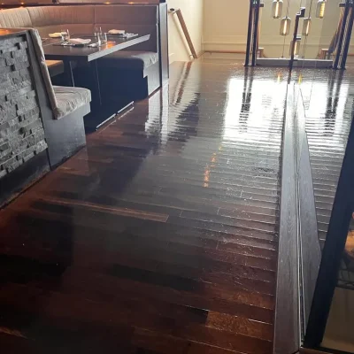 cleaning hardwood floors in restaurant