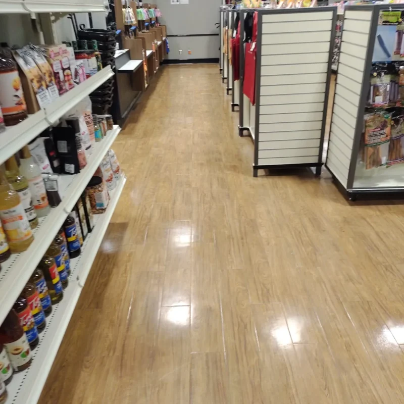 cleaning and polishing of hardwood floors in a store
